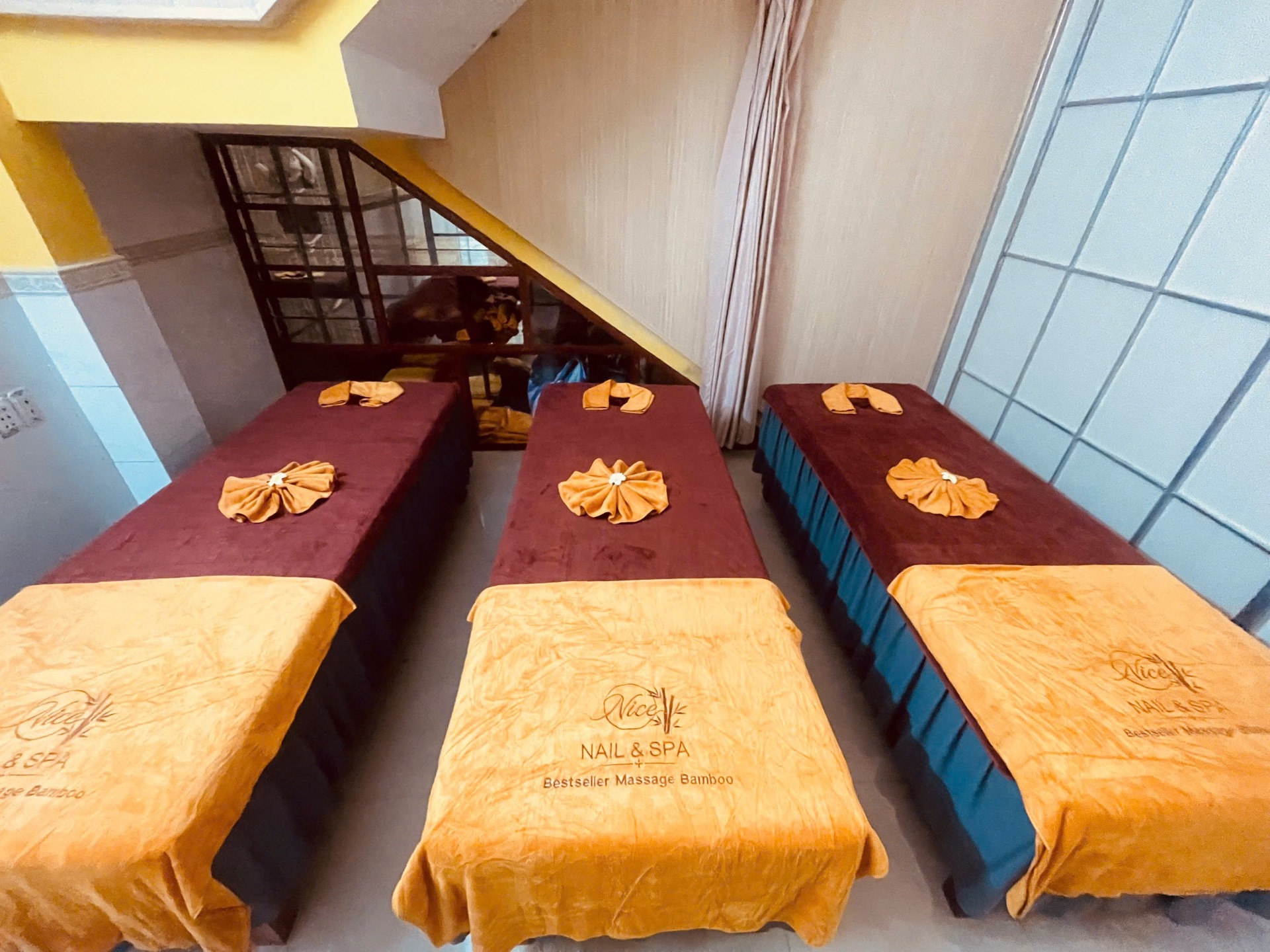 Multi-bed massage area at Nice Nail & Spa